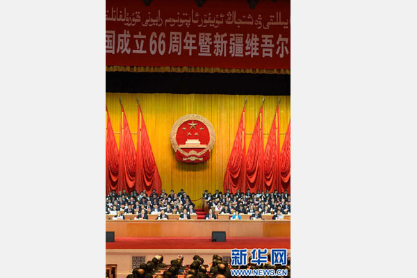10月1日，慶祝中華人民共和國成立66周年暨新疆維吾爾自治區(qū)成立60周年大會在新疆人民會堂隆重舉行。 新華社記者 高潔 攝 